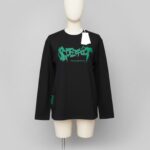 black long-sleeved shirt with a distinctive graphic print.