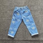 Primark blue jean with dinosaur character
