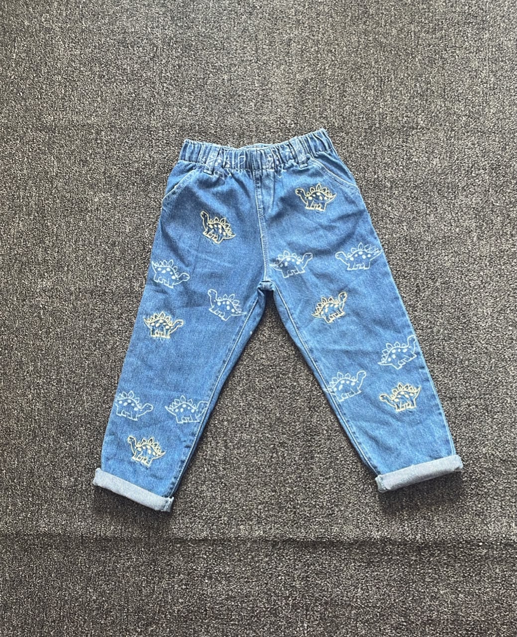 1780914122_whatsapp-image-2026-06-05-at-70047-am.jpeg Primark blue jean with dinosaur character - Image 1